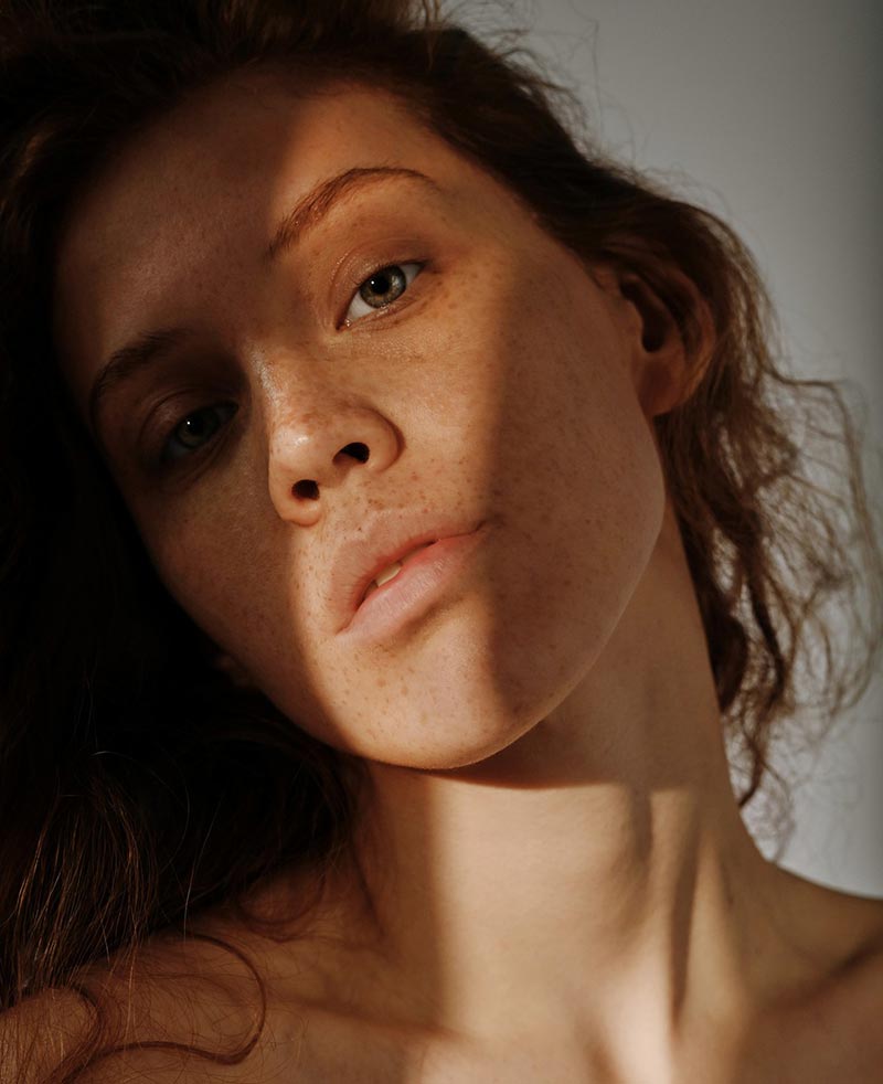 Woman with shadow on face